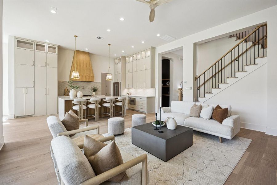 Designed for effortless everyday living and entertaining, the open living area flows right into the kitchen while a large sliding glass door folds neatly to one side, creating an easy connection to the covered summer kitchen. Recessed lighting, convenient floor plugs and thoughtfully selected Visual Comfort fixtures add both function and polish throughout.
