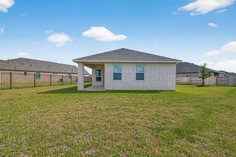 Exterior details and patio area of a home in Sunterra, Katy (Image 3).