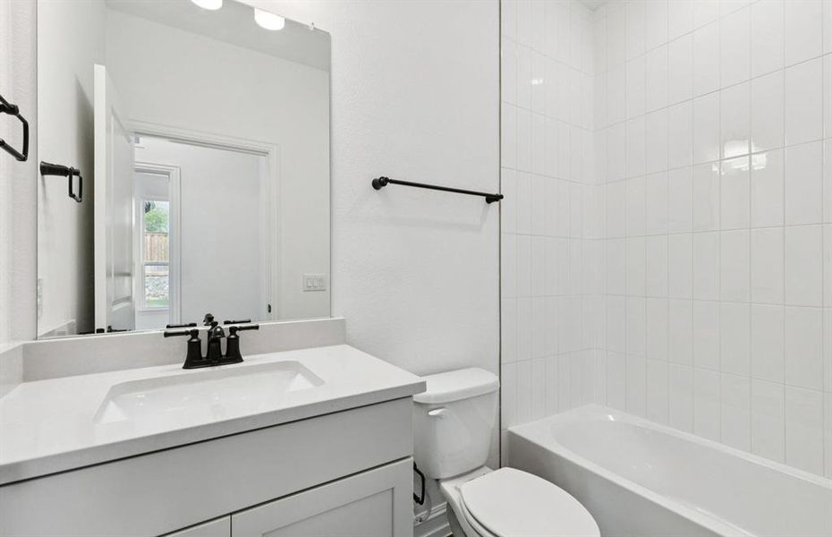 Elegant secondary bath with contemporary design   *Real home pictured