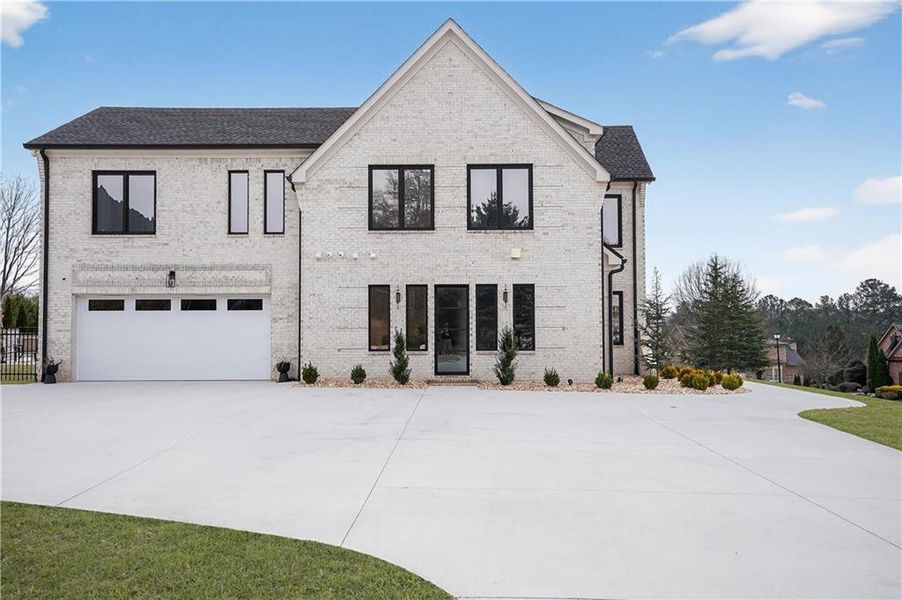 Front exterior of a new home in , Hoschton, GA, highlighting curb appeal (Image 29).