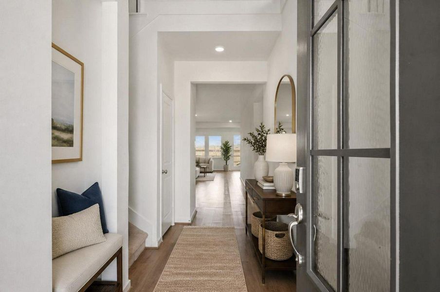 The entry opens with a bright, clean hallway and a direct sightline into the main living areas. Tall ceilings and a soft neutral palette set the tone for the home’s newer-construction feel. Virtually staged. The entry opens with a bright, clean hallway and a direct sightline into the main living areas. Tall ceilings and a soft neutral palette set the tone for the home’s newer-construction feel. Virtually staged.