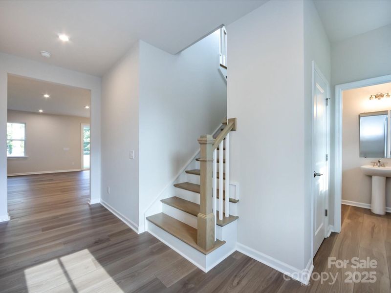 Step inside to a bright foyer highlighted by an open rail leading to the second floor.