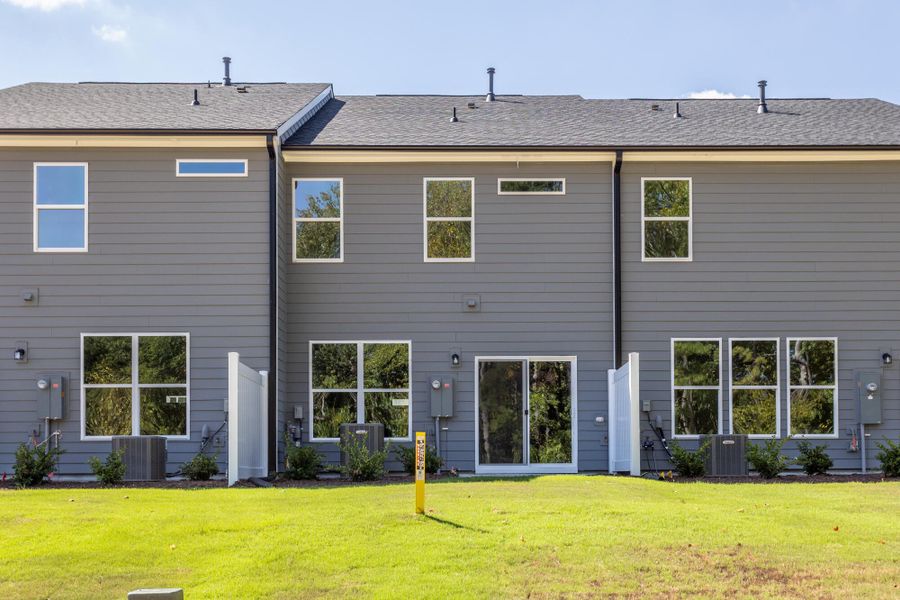 Exterior details and patio area of a home in Running Brook Townes, Durham (Image 2).