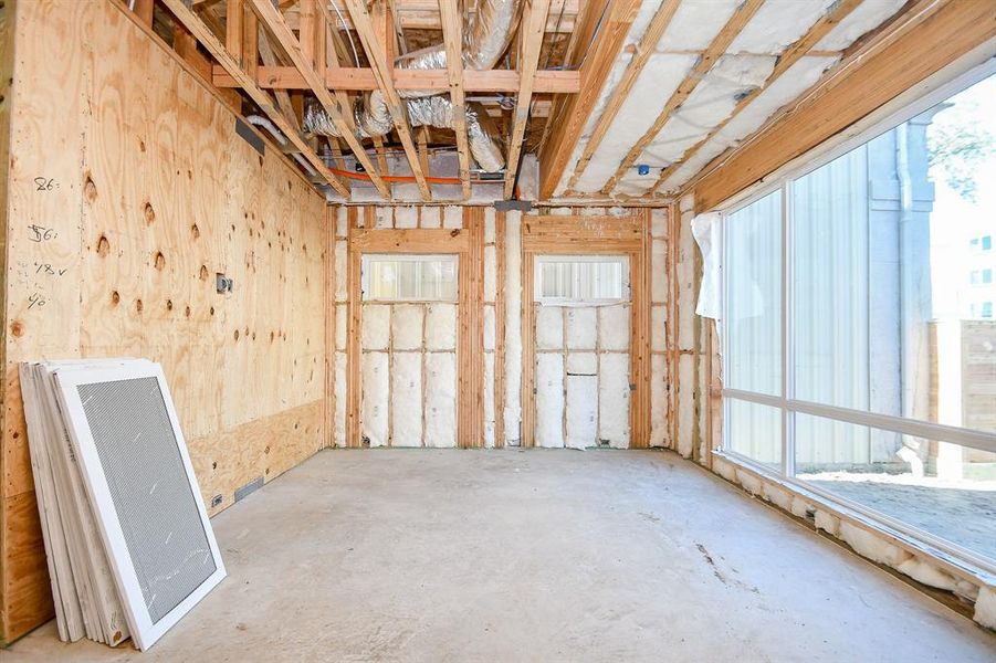 1st Floor Gameroom or Living Room. 24x48 tile to be installed. Large Architectural style Sierra Pacific windows installed.