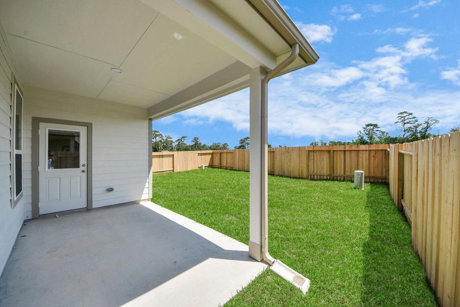 Come and see this spacious backyard with its beautiful covered patio. There is plenty of room for the kids to play and adults to relax. Perfect for your outdoor living space, patio furniture, bbq pit, and so much more. The possibilities are endless! Sample photo of completed home with similar floor plan. Actual colors and selections may vary.