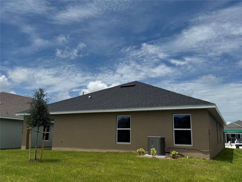 Front exterior of a new home in Harmony Central, Harmony, FL, highlighting curb appeal (Image 22).