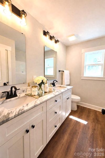 Main Bath with dual marble vanities.