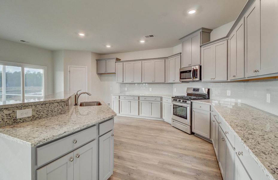 Furnished interior view inside a new home in Sweetgrass at Summers Corner, Summerville (Image 5).