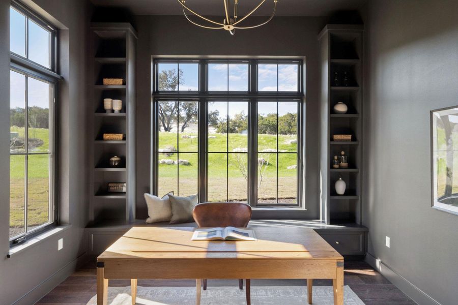 Study downstairs with built-in shelving and tons of natural light!