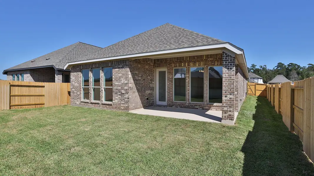 Exterior details and patio area of a home in Grand Central Park 45', Conroe (Image 3).