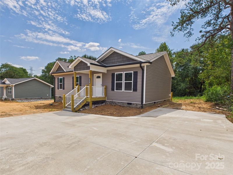 Front exterior of a new home in , Connelly Springs, NC, highlighting curb appeal (Image 17). Front exterior of a new home in , Connelly Springs, NC, highlighting curb appeal (Image 17).