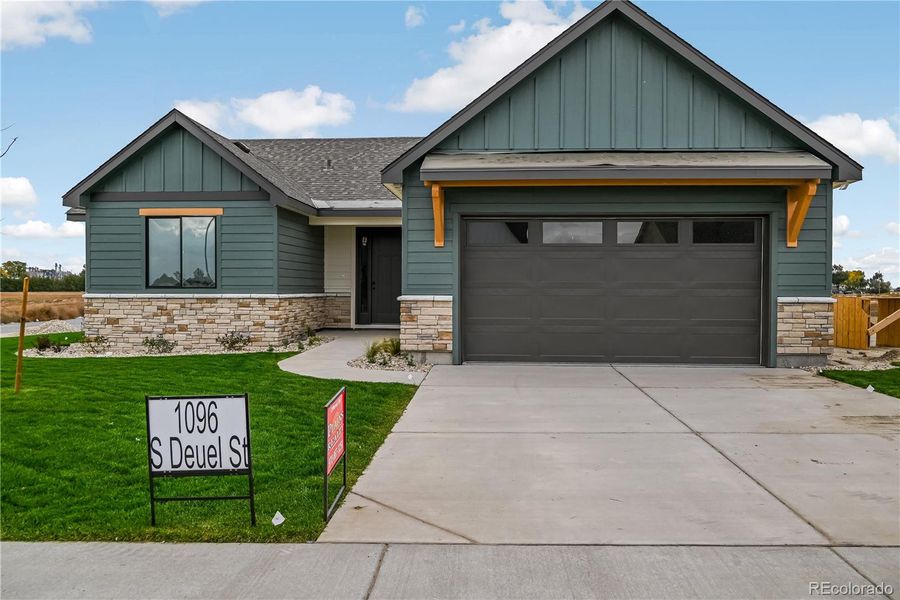 Front exterior of a new home in , Fort Morgan, CO, highlighting curb appeal (Image 1). Front exterior of a new home in , Fort Morgan, CO, highlighting curb appeal (Image 1).