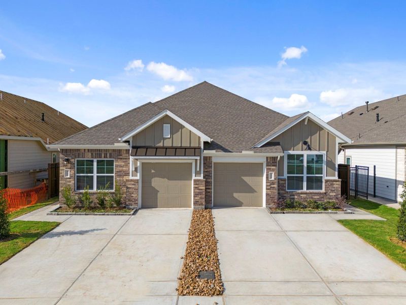 Front exterior of a new home in Meridiana, Iowa Colony, TX, highlighting curb appeal (Image 17). Front exterior of a new home in Meridiana, Iowa Colony, TX, highlighting curb appeal (Image 17).