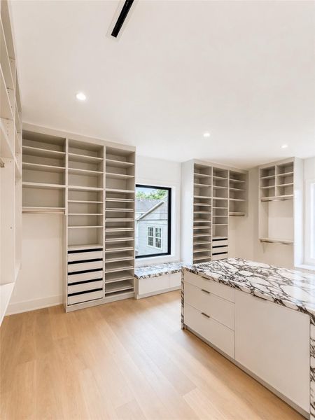 Primary closet provides amble room.