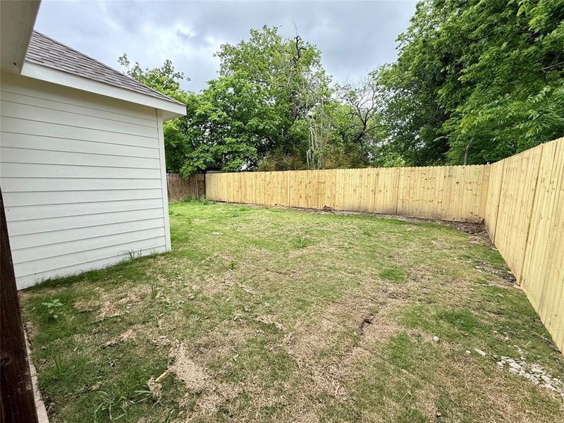 View of fenced backyard