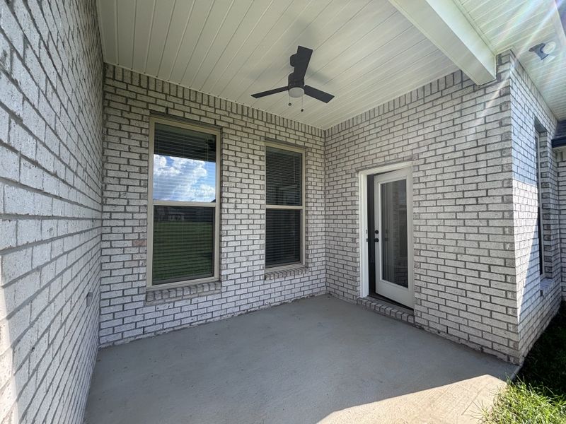 Exterior details and patio area of a home in Bird Song at Hammock Bay, Freeport (Image 4).