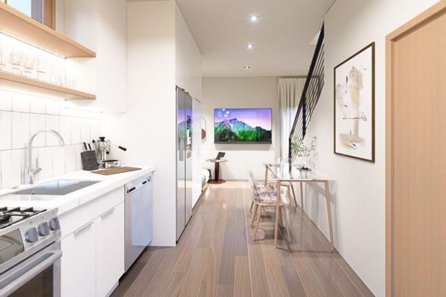 Stylish kitchen and dining area featuring sleek cabinetry, modern appliances, and an open layout with warm natural light.