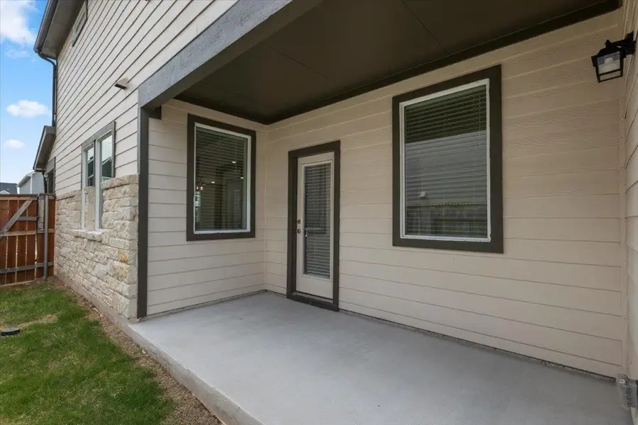 A covered patio offers an ideal outdoor living extension, perfect for relaxation or gatherings.