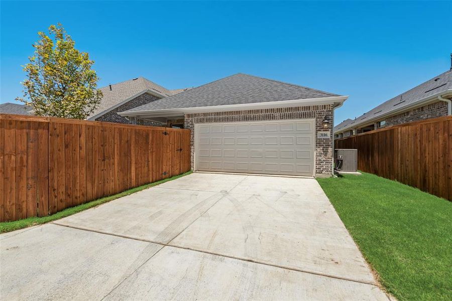 Front exterior of a new home in Arbors at Legacy Hills, Celina, TX, highlighting curb appeal (Image 2). Front exterior of a new home in Arbors at Legacy Hills, Celina, TX, highlighting curb appeal (Image 2).