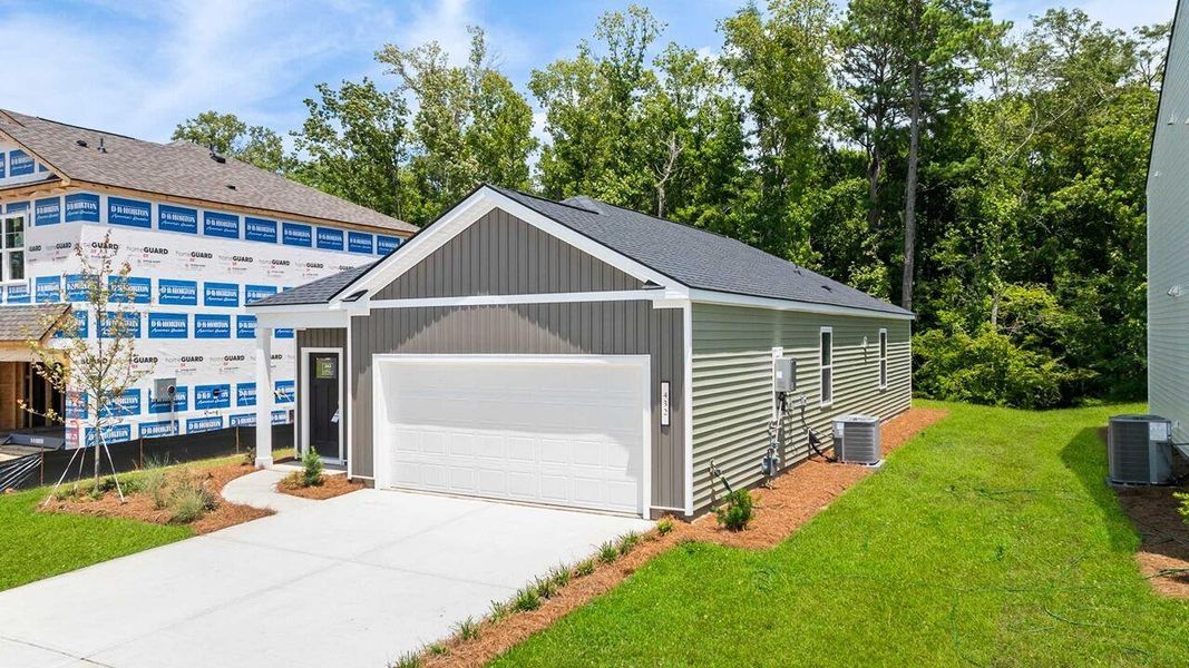 Front exterior of a new home in Carolina Groves, Moncks Corner, SC, highlighting curb appeal (Image 2).