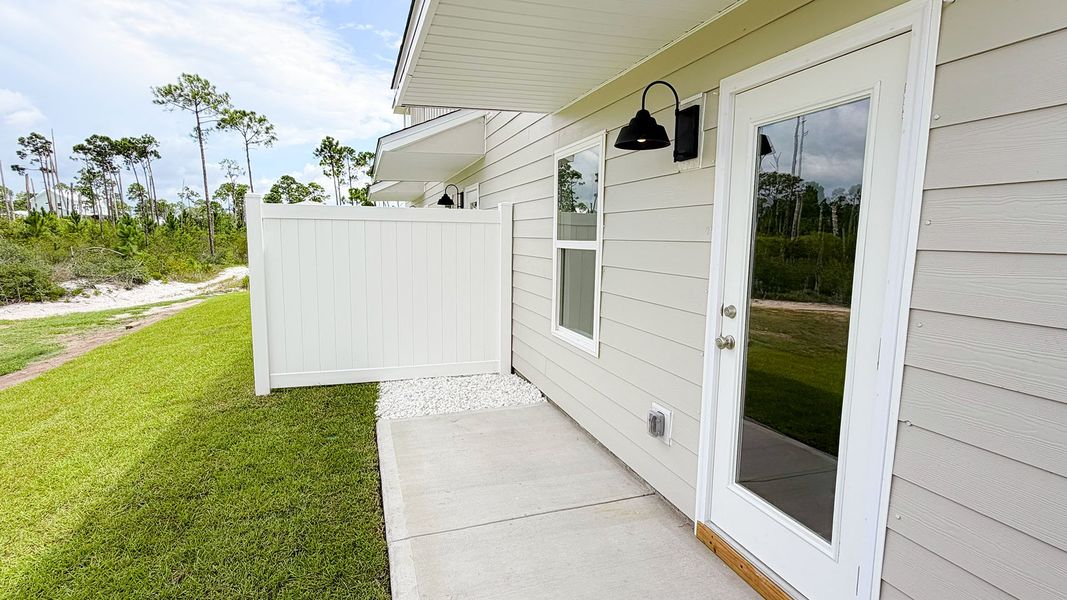 Exterior details and patio area of a home in WindMark Beach, Port Saint Joe (Image 21).