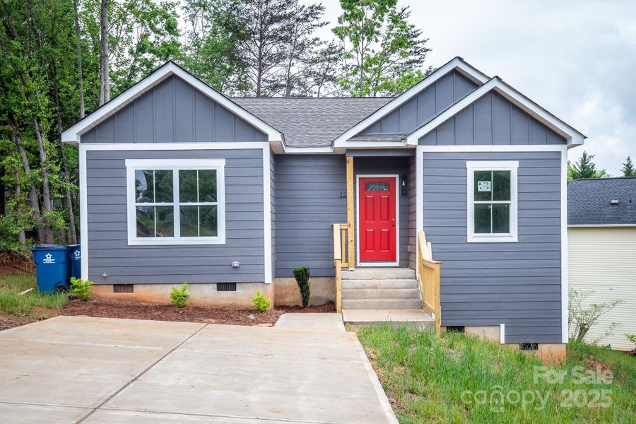 Front exterior of a new home in , Hickory, NC, highlighting curb appeal (Image 1).