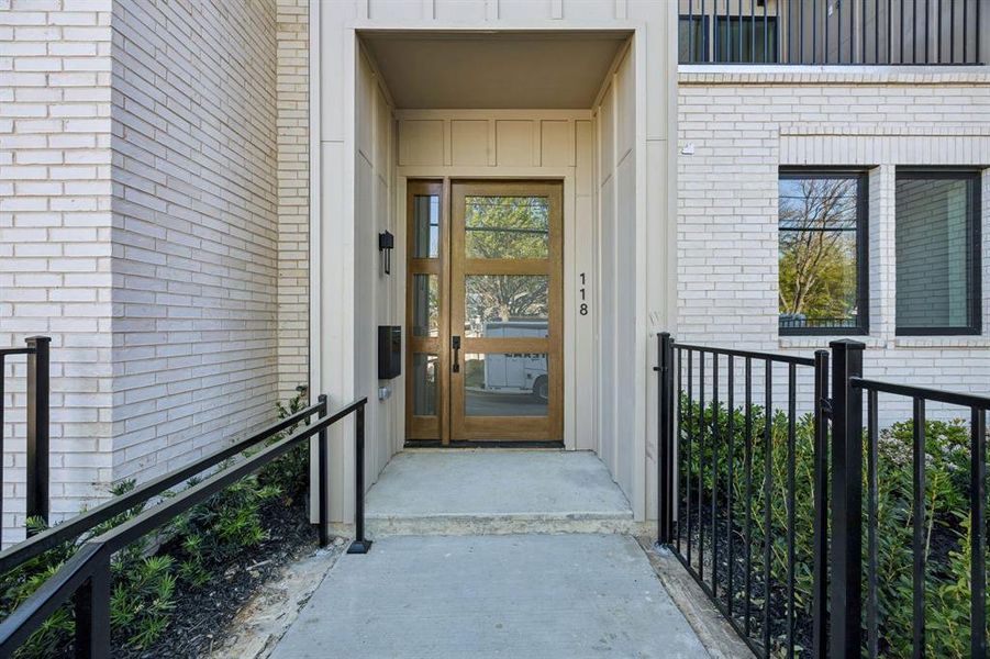 View of exterior entry featuring brick siding and board and batten siding View of exterior entry featuring brick siding and board and batten siding