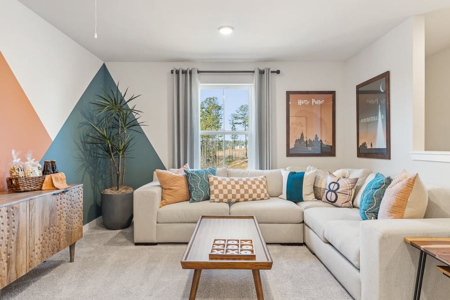 A living room with a couch and a coffee table. A living room with a couch and a coffee table.