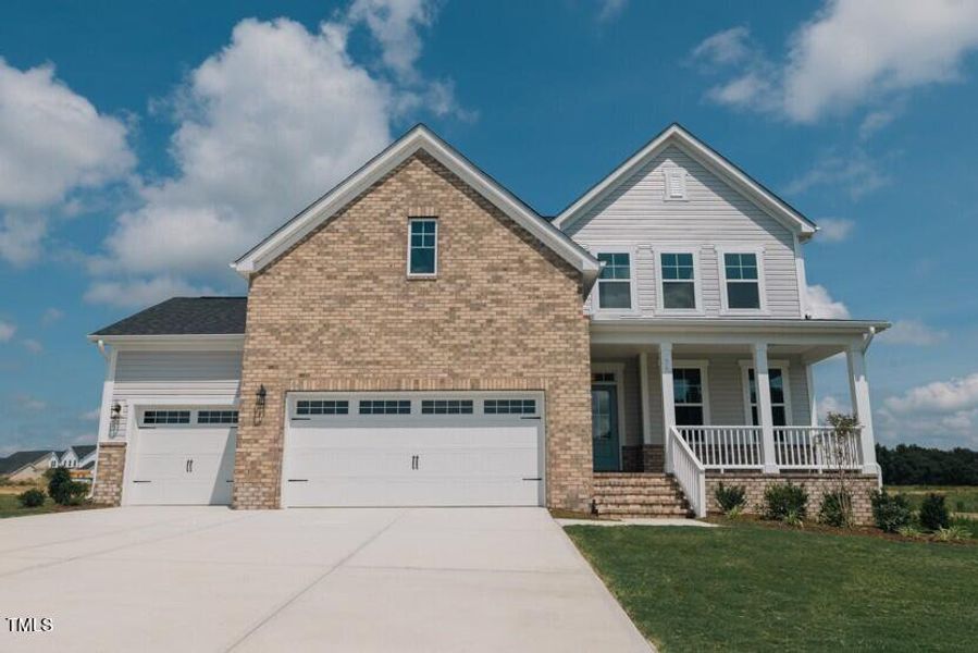 Front exterior of a new home in Tobacco Road, Angier, NC, highlighting curb appeal (Image 87). Front exterior of a new home in Tobacco Road, Angier, NC, highlighting curb appeal (Image 87).