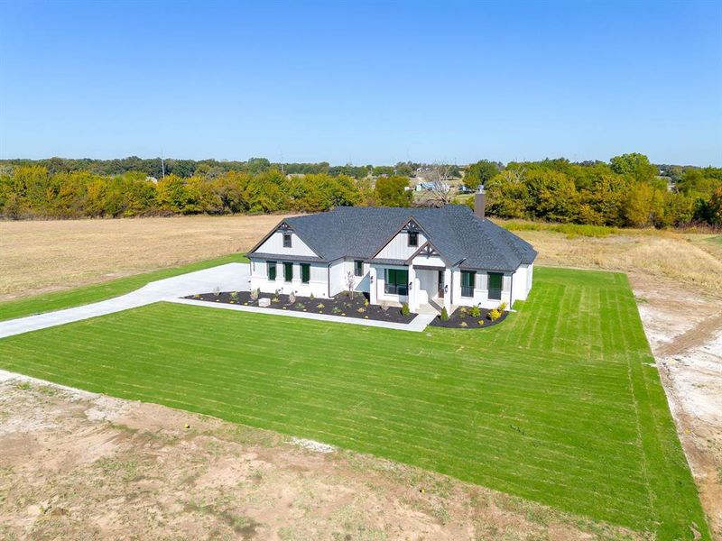 Front exterior of a new home in , Weatherford, TX, highlighting curb appeal (Image 17).