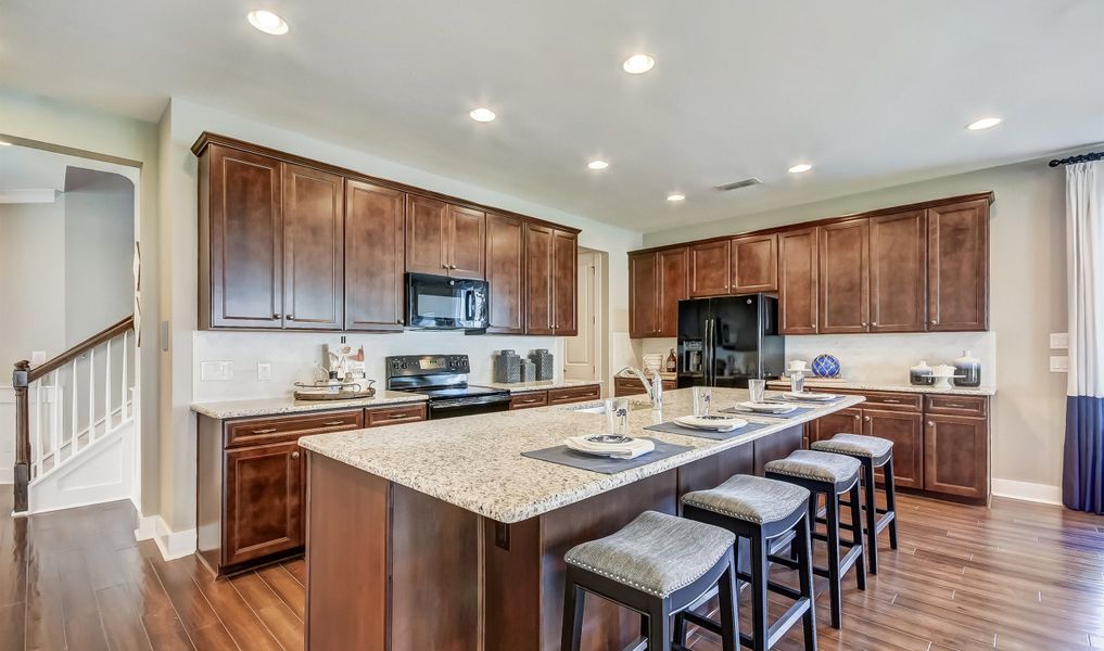 Breakfast bar at island in kitchen