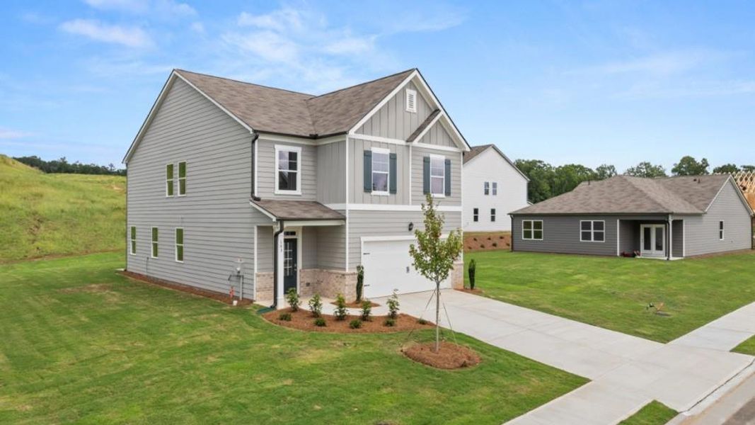 Front exterior of a new home in Sheffield Highlands, Dallas, GA, highlighting curb appeal (Image 19).