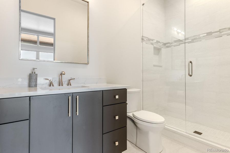 Every bath is uniquely decorated with custom tile and thoughtfully curated fixtures.