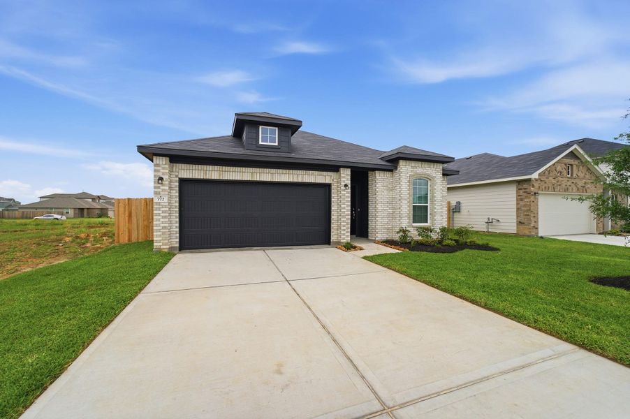Front exterior of a new home in Trails at Woodhaven Lakes, La Marque, TX, highlighting curb appeal (Image 2).