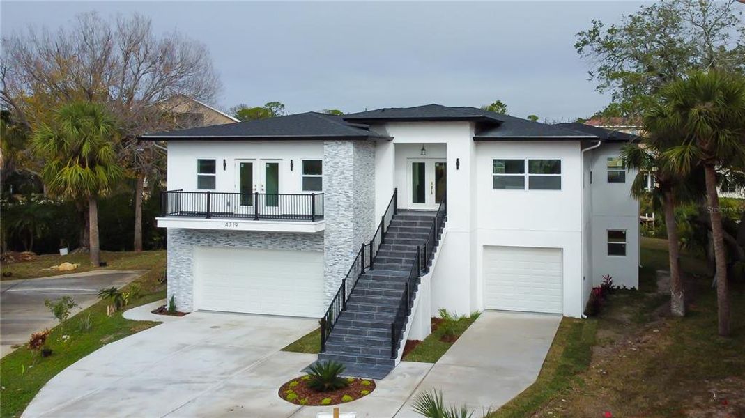 Front exterior of a new home in , New Port Richey, FL, highlighting curb appeal (Image 27).