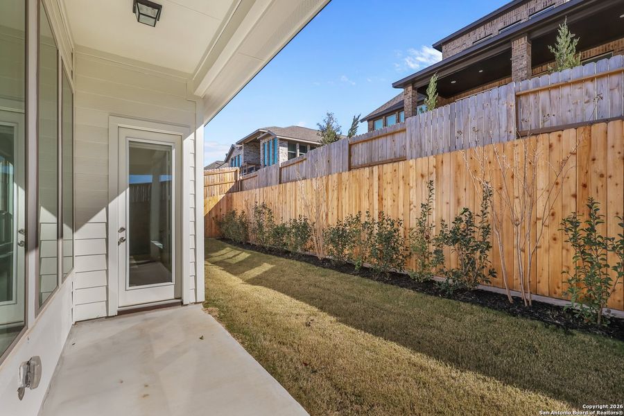 Exterior details and patio area of a home in Homestead 65', Schertz (Image 24).