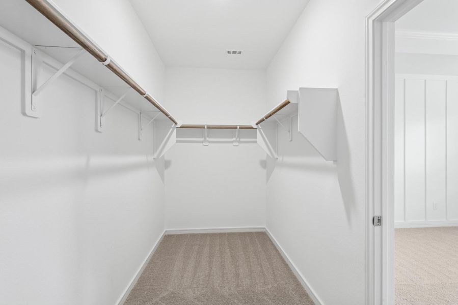 Primary walk-in closet (*Photo not of actual home and used for illustration purposes only.)