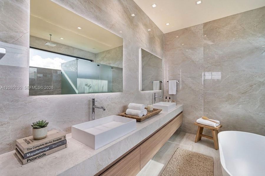 Primary Bathroom. Disclaimer: Several photographs presented in this listing contain digitally added furniture, artwork, and decor. These virtually staged images are intended solely for illustrative purposes.