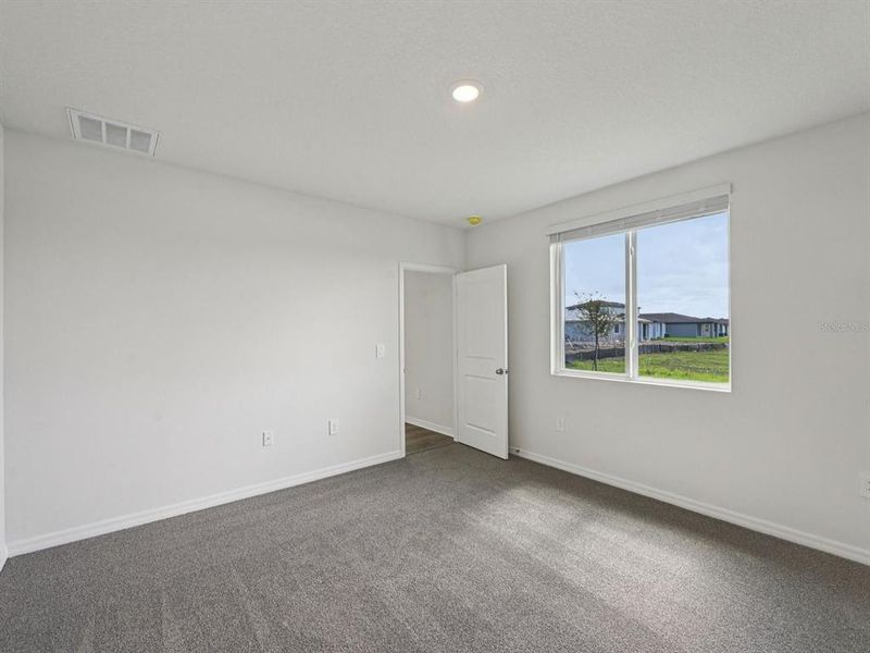 Spacious, unfurnished interior of a new home in Magnolia Bay - Premier Series, Nokomis (Image 20).
