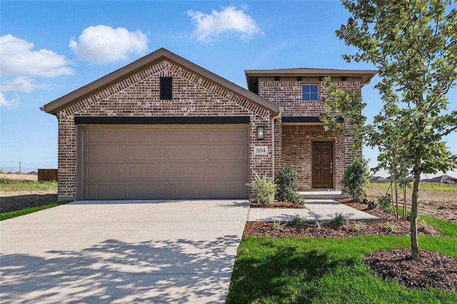 View of front of property featuring brick siding, concrete driveway, and a garage View of front of property featuring brick siding, concrete driveway, and a garage