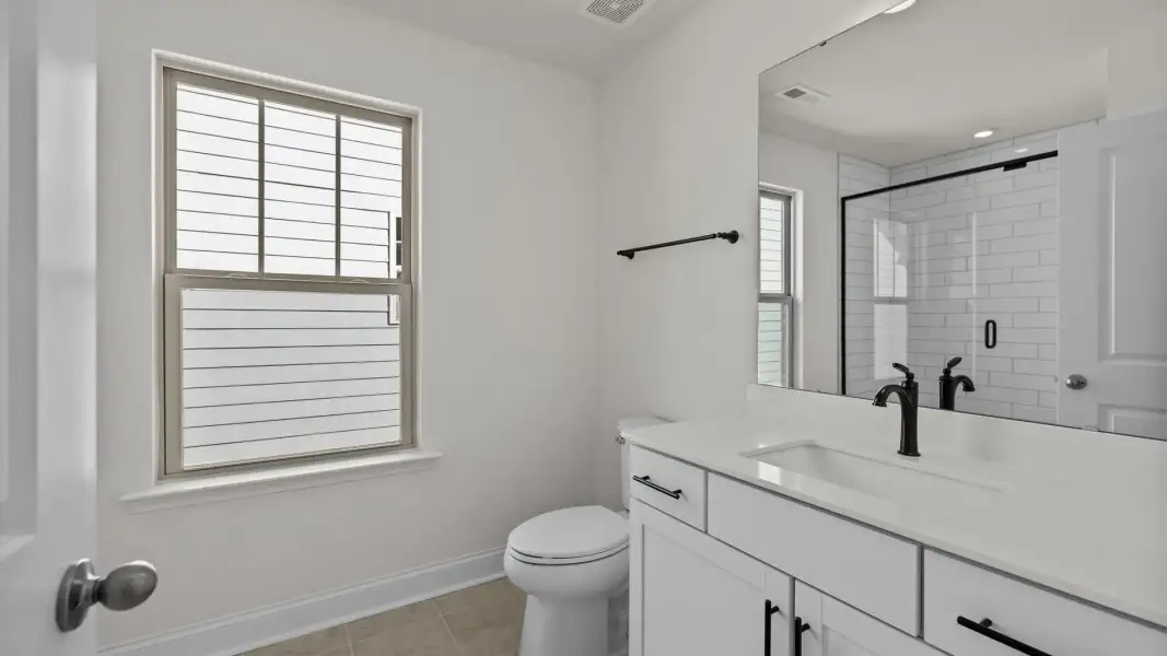 Bathroom with window and primum finishes in the Norris Design by DRB Homes in York, SC Bathroom with window and primum finishes in the Norris Design by DRB Homes in York, SC