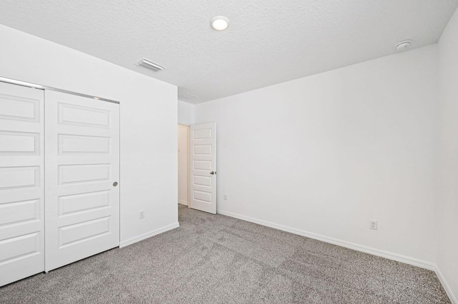 Spacious, unfurnished interior of a new home in Hampton Park - Classic Series, Vero Beach (Image 22).