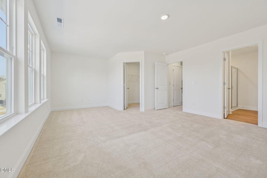 Primary Suite with walk in closet Primary Suite with walk in closet