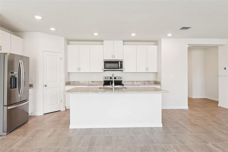 Furnished interior view inside a new home in Two Rivers - Classic Series, Zephyrhills (Image 3).