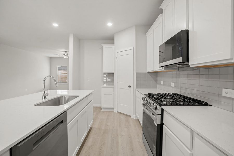 Furnished interior view inside a new home in Sunterra, Katy (Image 7).