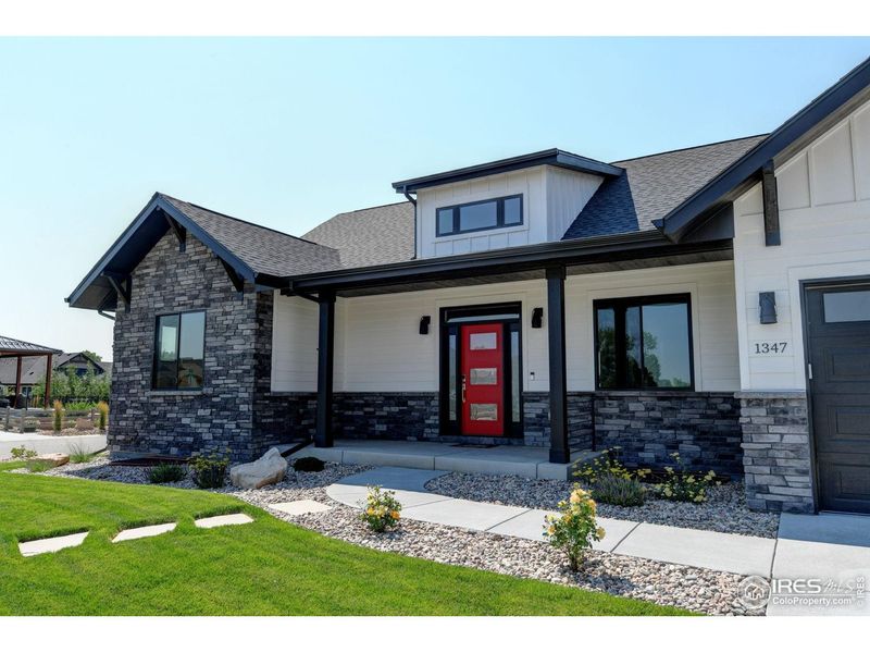 Front exterior of a new home in Harvest Ridge, Berthoud, CO, highlighting curb appeal (Image 26).