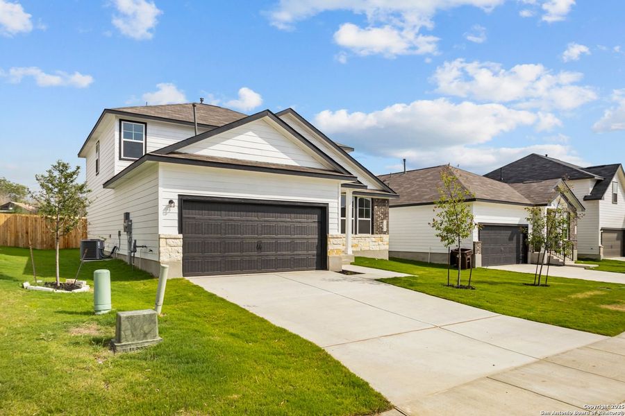 Front exterior of a new home in Horizon Pointe, Converse, TX, highlighting curb appeal (Image 66).