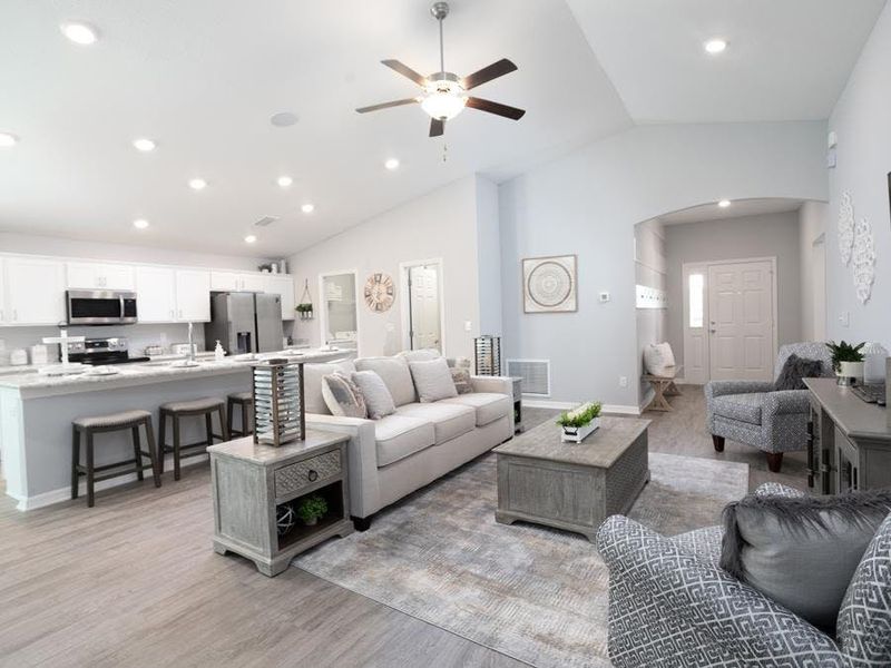 Entertain with ease with a welcoming open living area - Raychel II home plan by Highland Homes Entertain with ease with a welcoming open living area - Raychel II home plan by Highland Homes