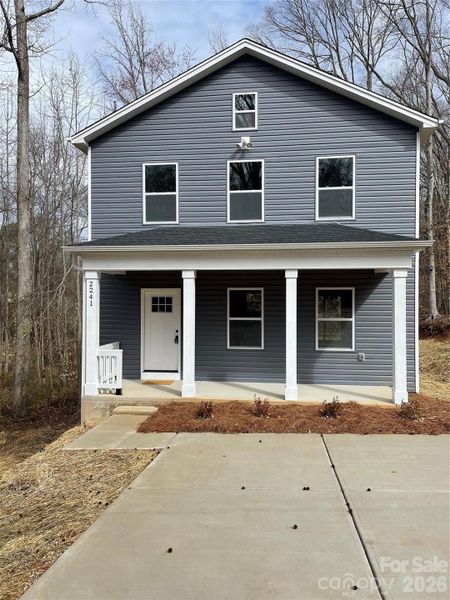 Front exterior of a new home in , Statesville, NC, highlighting curb appeal (Image 18).