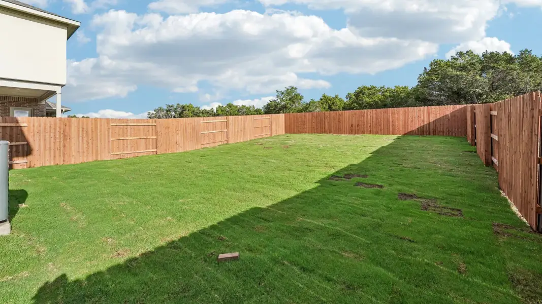 Exterior details and patio area of a home in Bar W Ranch, Leander (Image 21).
